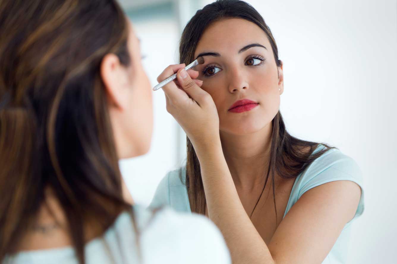 Girl putting on makeup